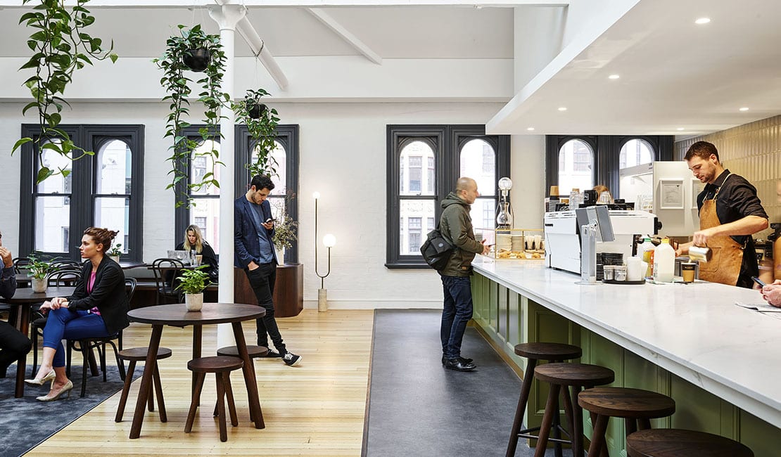 Hub Collins Street Cafe with people working and lining up to order coffee