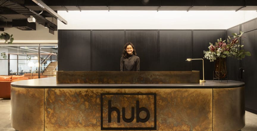 smiling concierge at desk