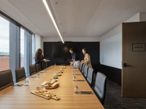a meeting room with catering on the table