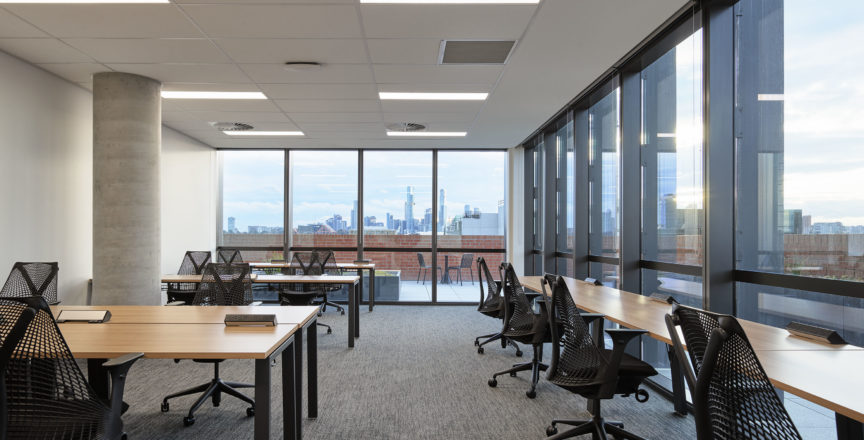 office with a large window overlooking the city