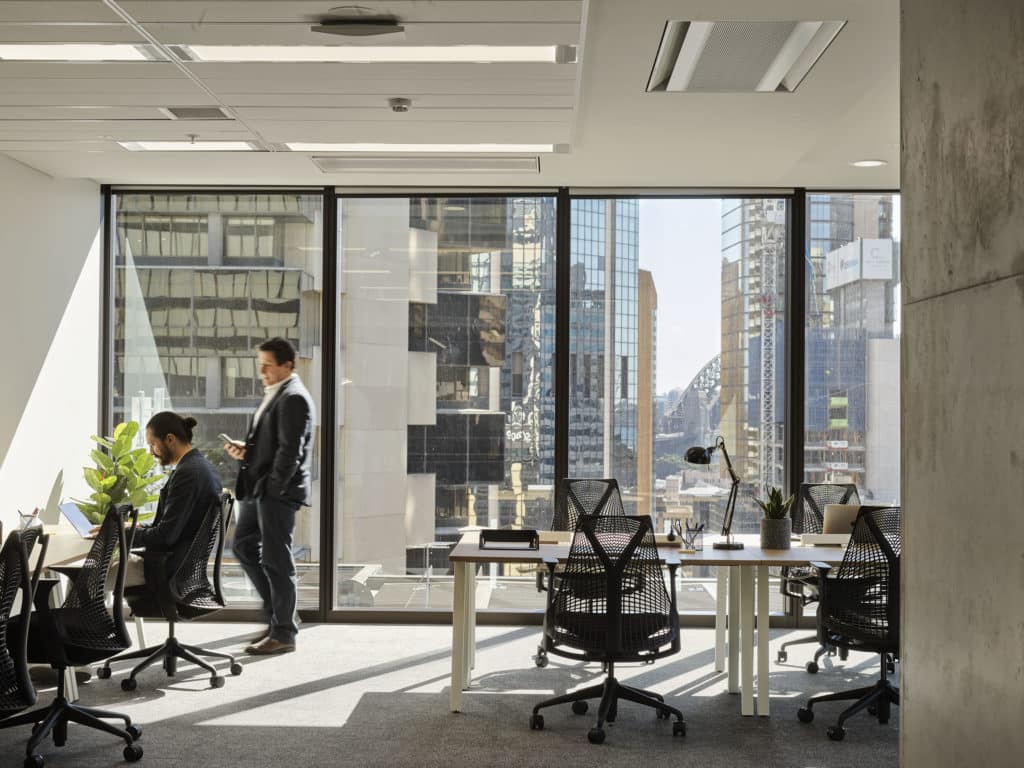 office with views of Sydney Harbour in the background