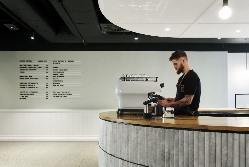 barista at coffee machine