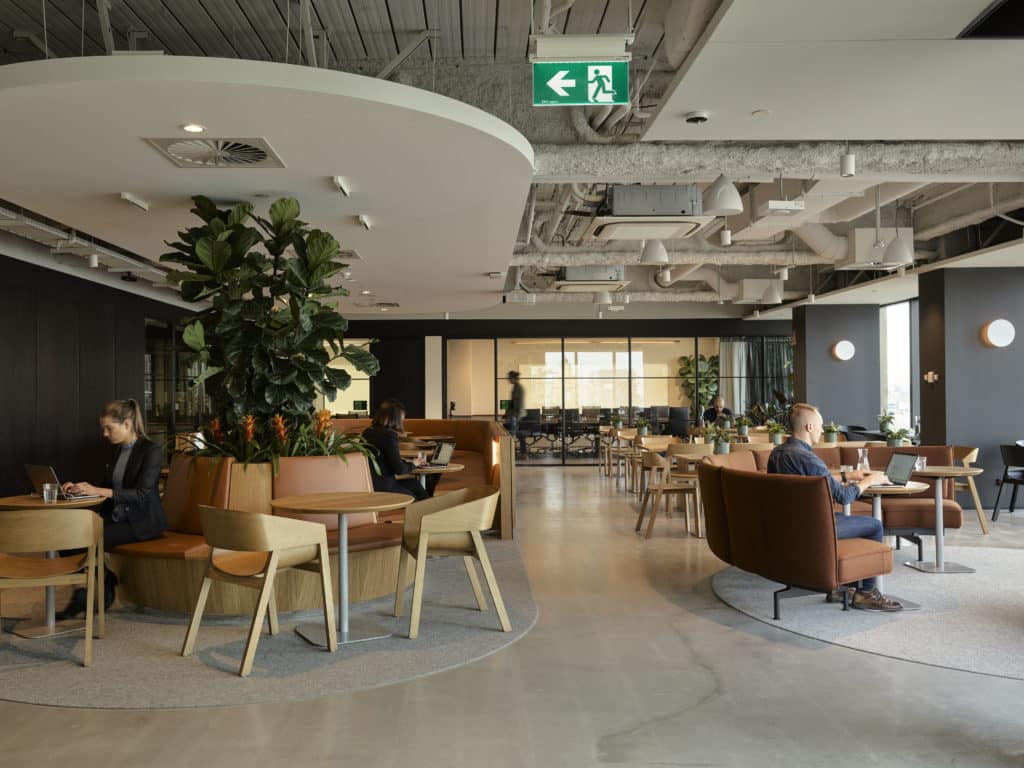 people working in a coworking space at Hub Flinders Street