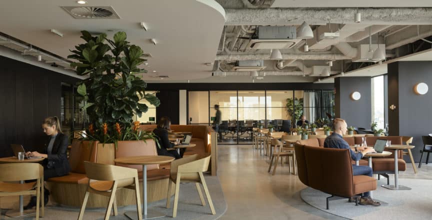 people working in a coworking space at Hub Flinders Street