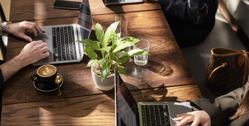 People working in the café lounge at Hub Collins Street
