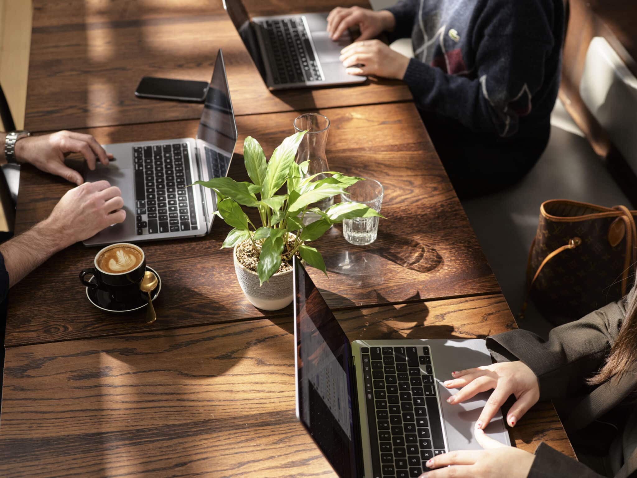 People working in the café lounge at Hub Collins Street