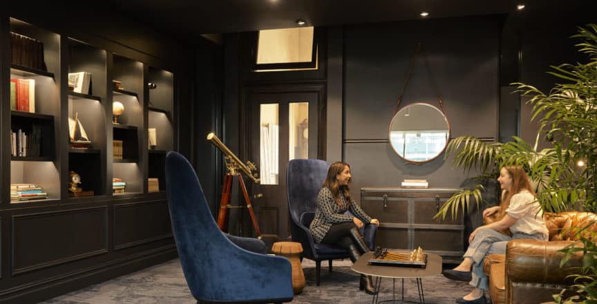 people sitting on a couch in an office