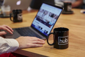 a Hub australia mug and laptop