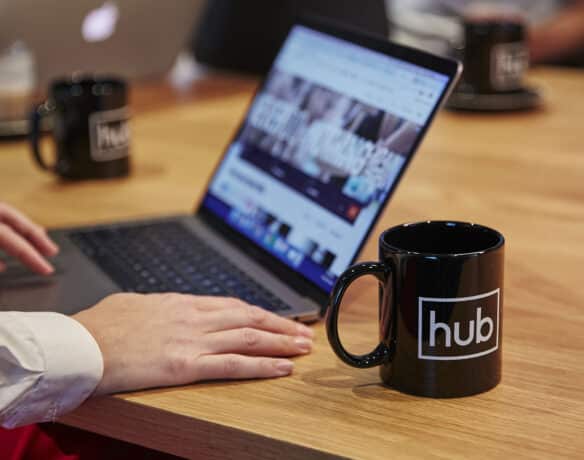 a Hub australia mug and laptop