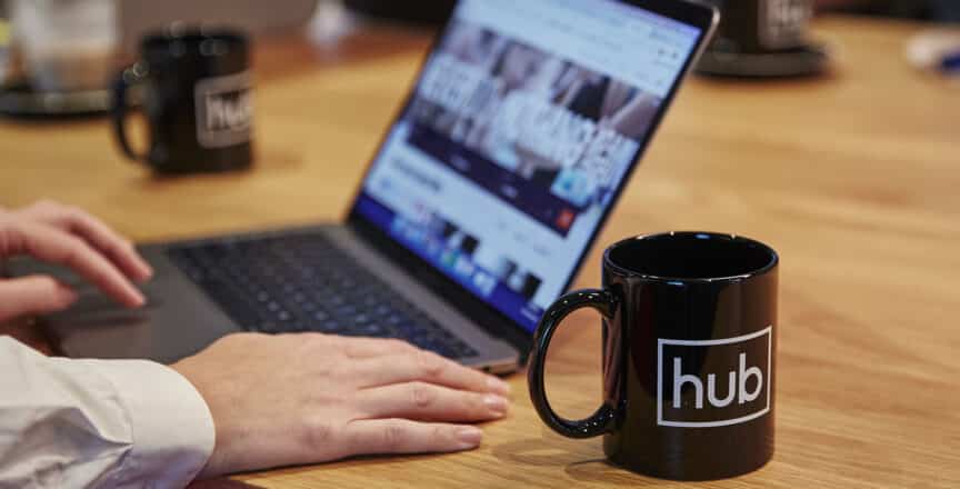 a Hub australia mug and laptop