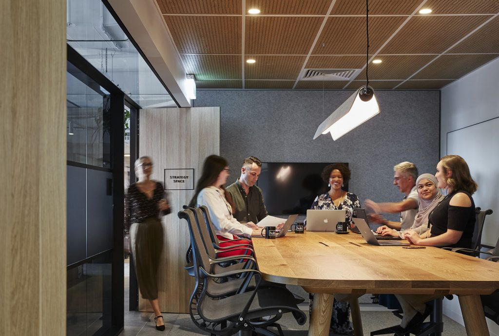 group of people having a meeting in the Hub Hyde Park strategy space