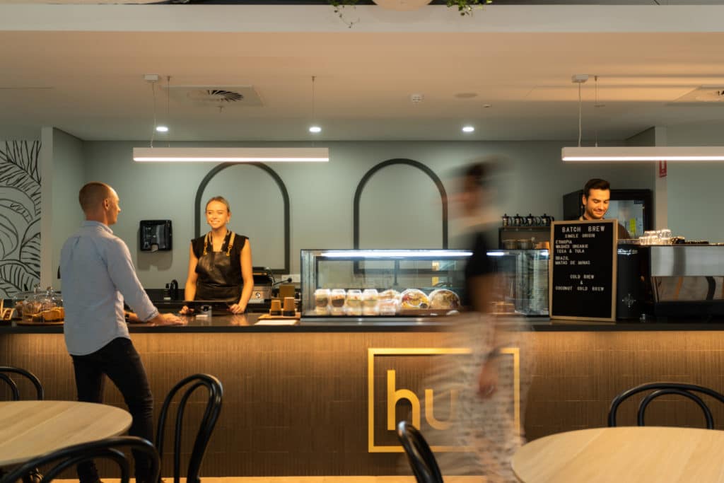people working in a cafe