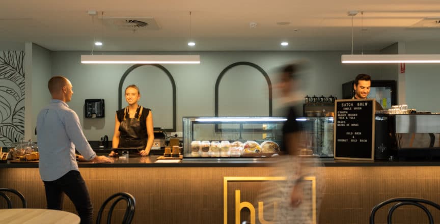people working in a cafe