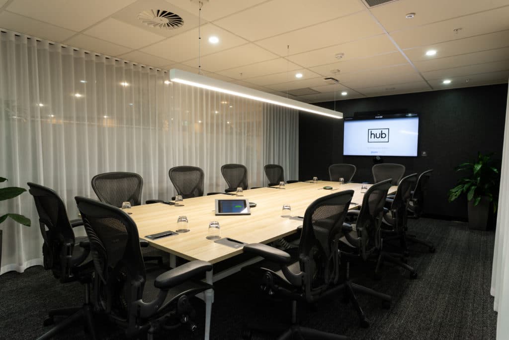 boardroom with chairs and TV screen
