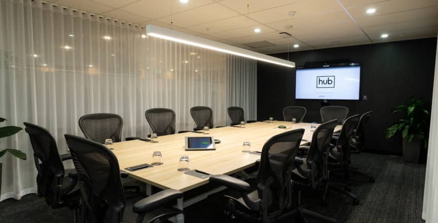 boardroom with chairs and TV screen