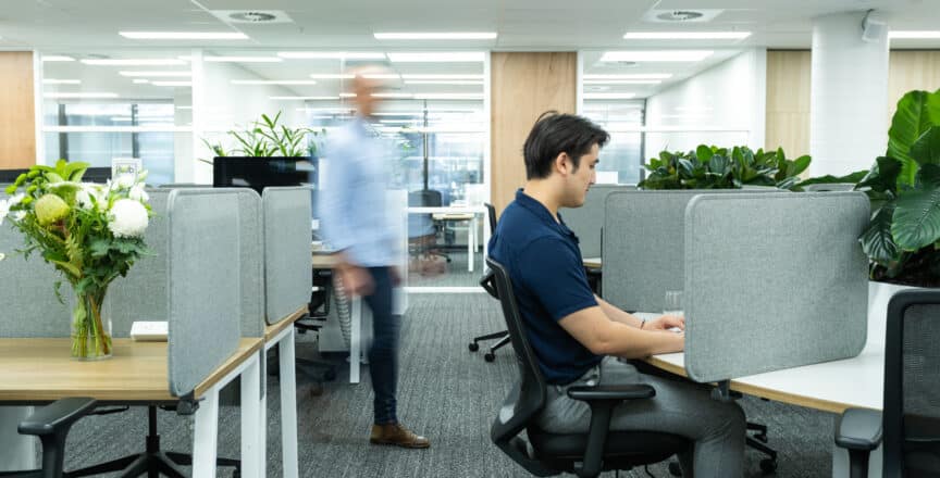man working on desk space