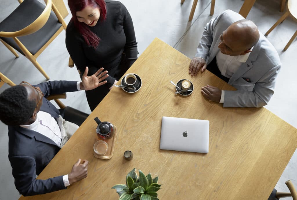 group of people having a meeting in a cafe