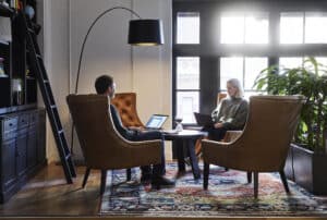 people in chairs meeting