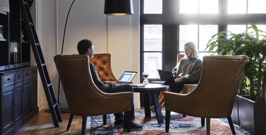 people in chairs meeting
