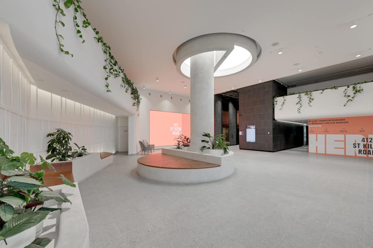 St Kilda Road bright white foyer with indoor plants.