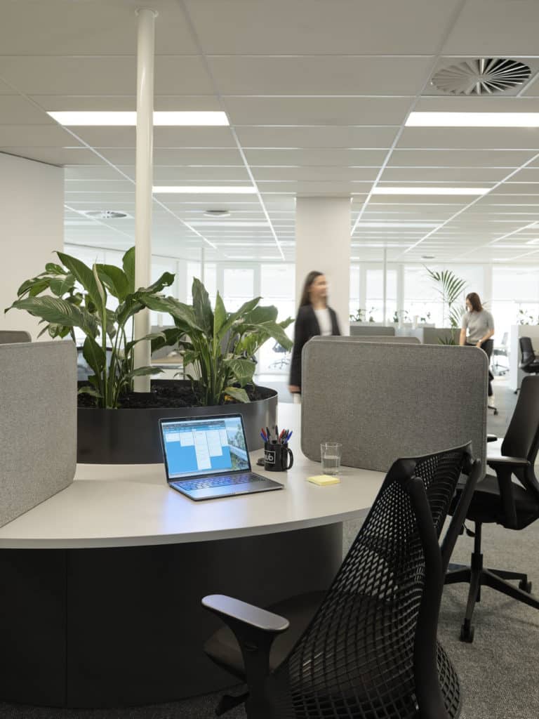 desk with open laptop and chair