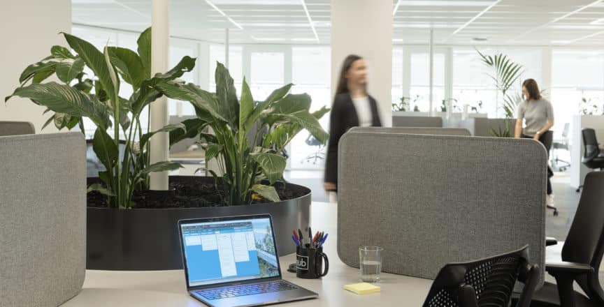 desk with open laptop and chair