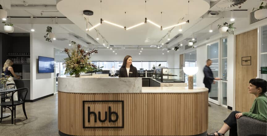 Welcome desk at Hub St Kilda Road with two people