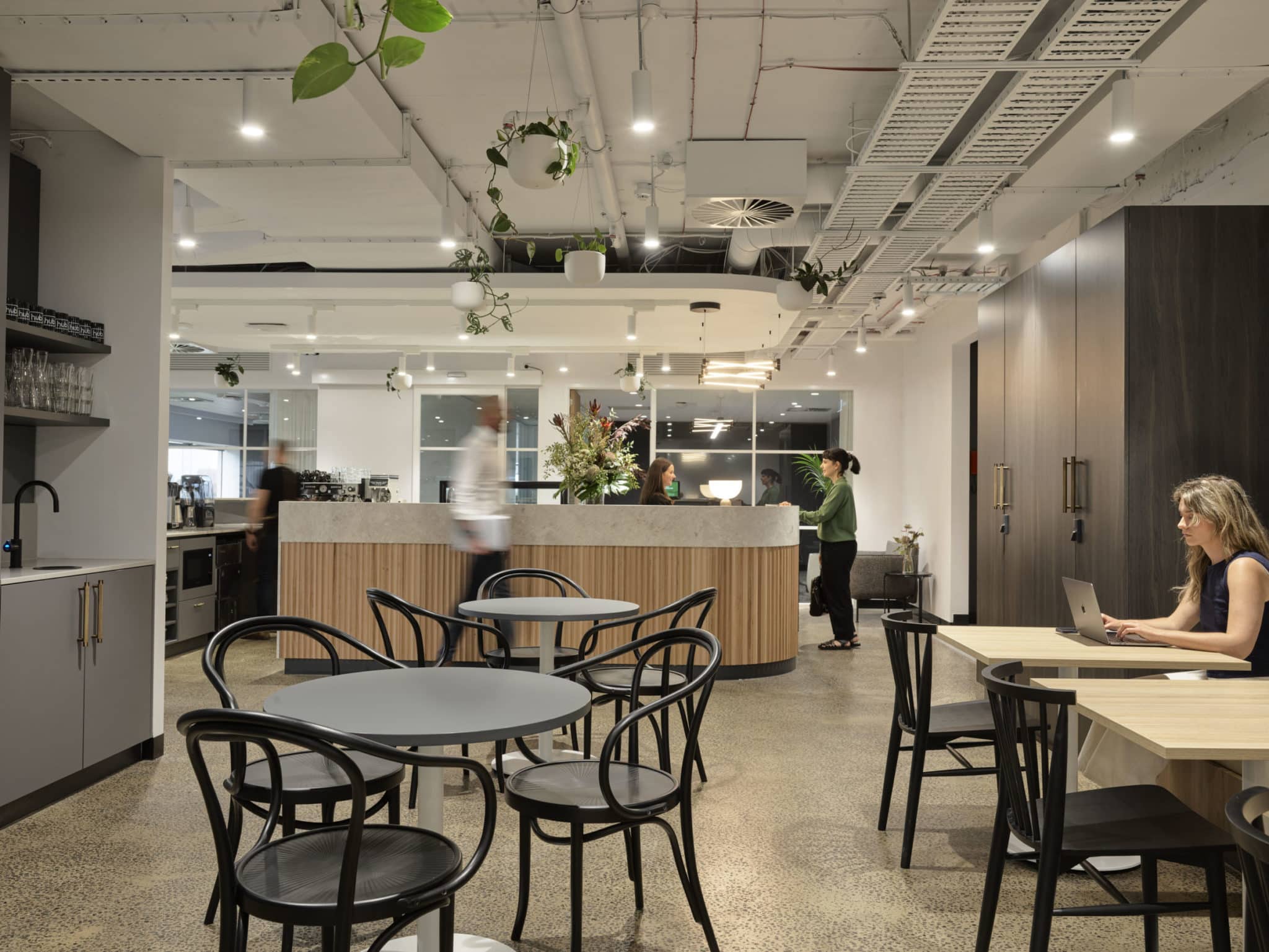 people talking in cafe area at Hub St Kilda Road