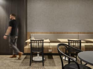 man walking through cafe space