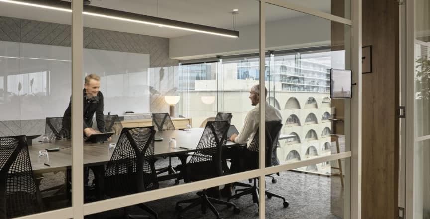 two people having a meeting in a room