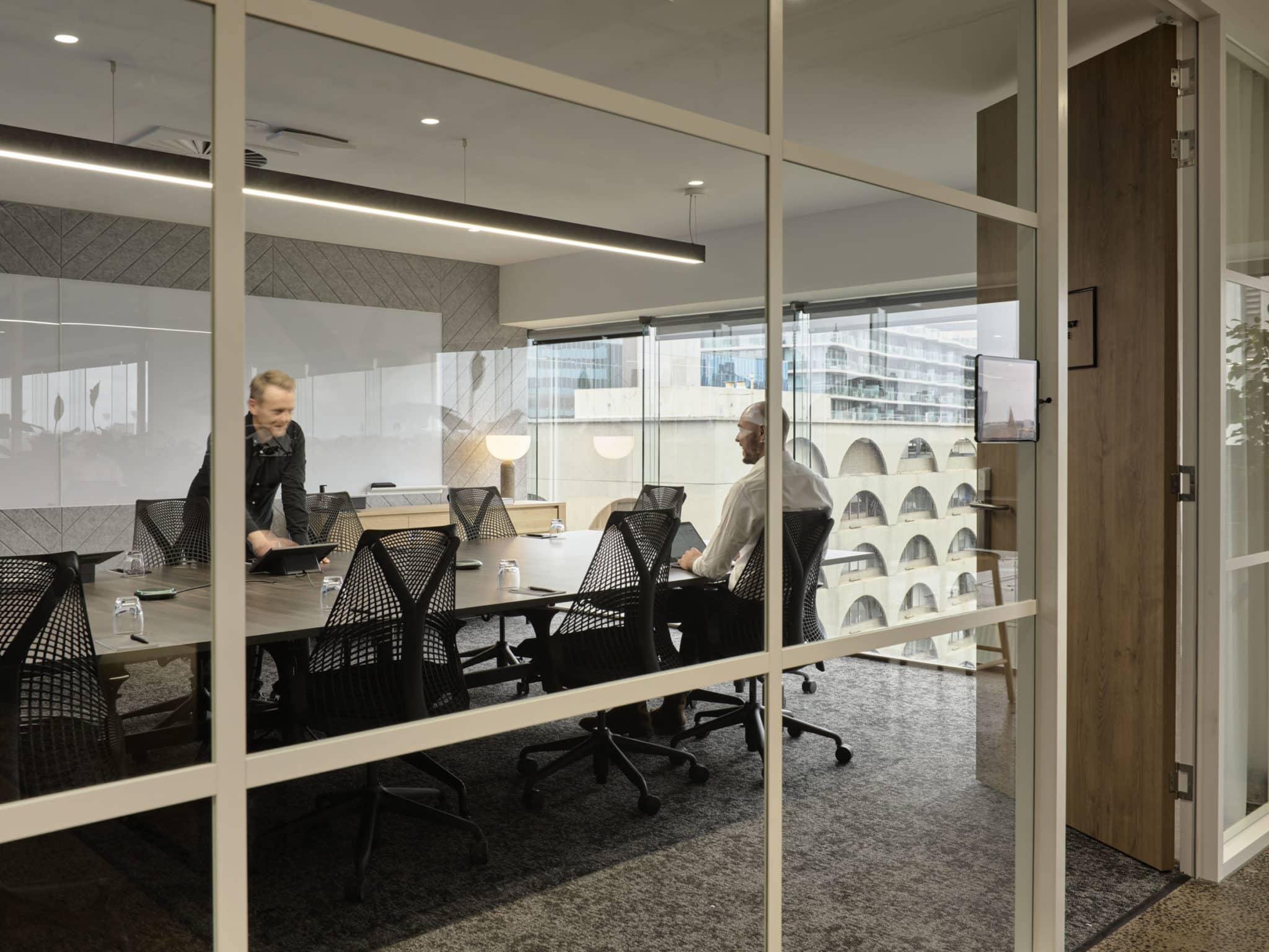 two people having a meeting in a room at Hub St Kilda Road