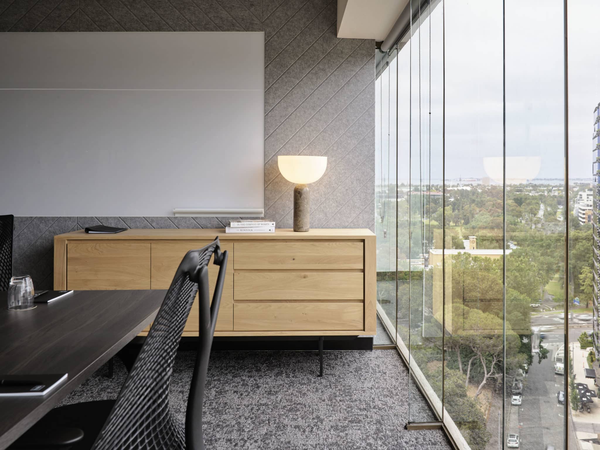 detail of chairs in a boardroom with view overlooking greenery at Hub St Kilda Road