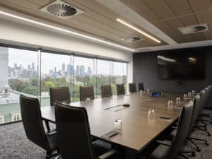 boardroom with chairs and tv