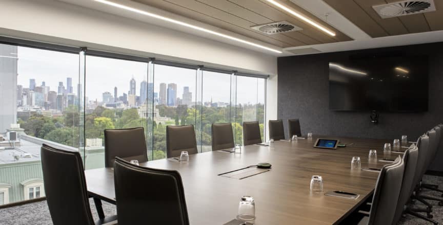 boardroom with chairs and tv