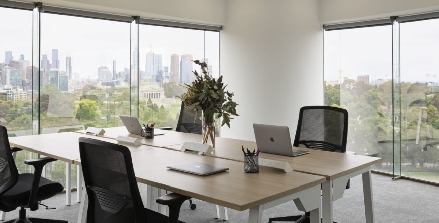 office with desk and chairs and a view over Melbourne