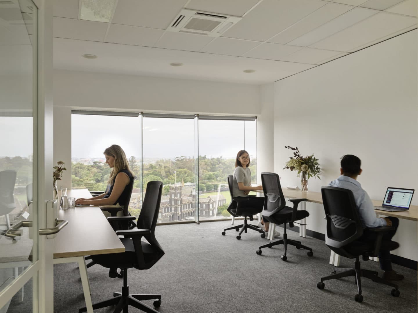 people working in office with a view at Hub St Kilda Road