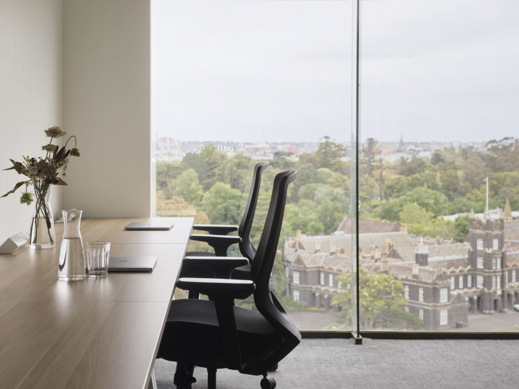 two office chairs with view in window