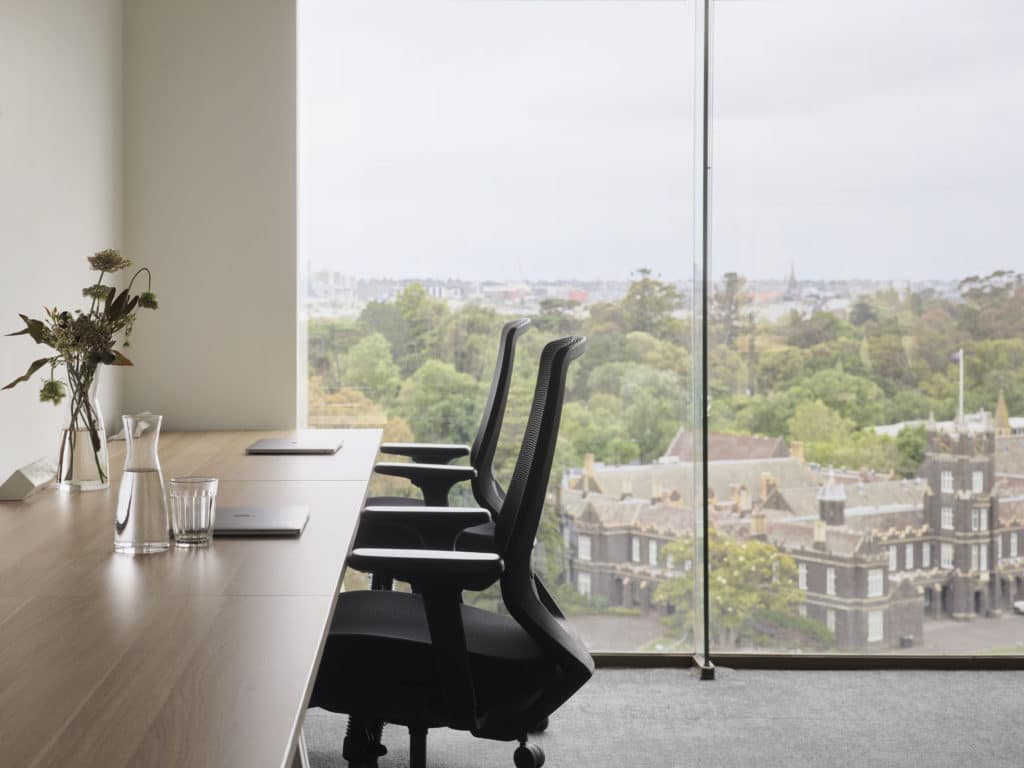two office chairs with view in window