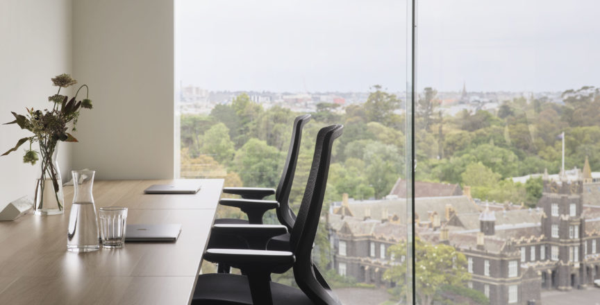 two office chairs with view in window