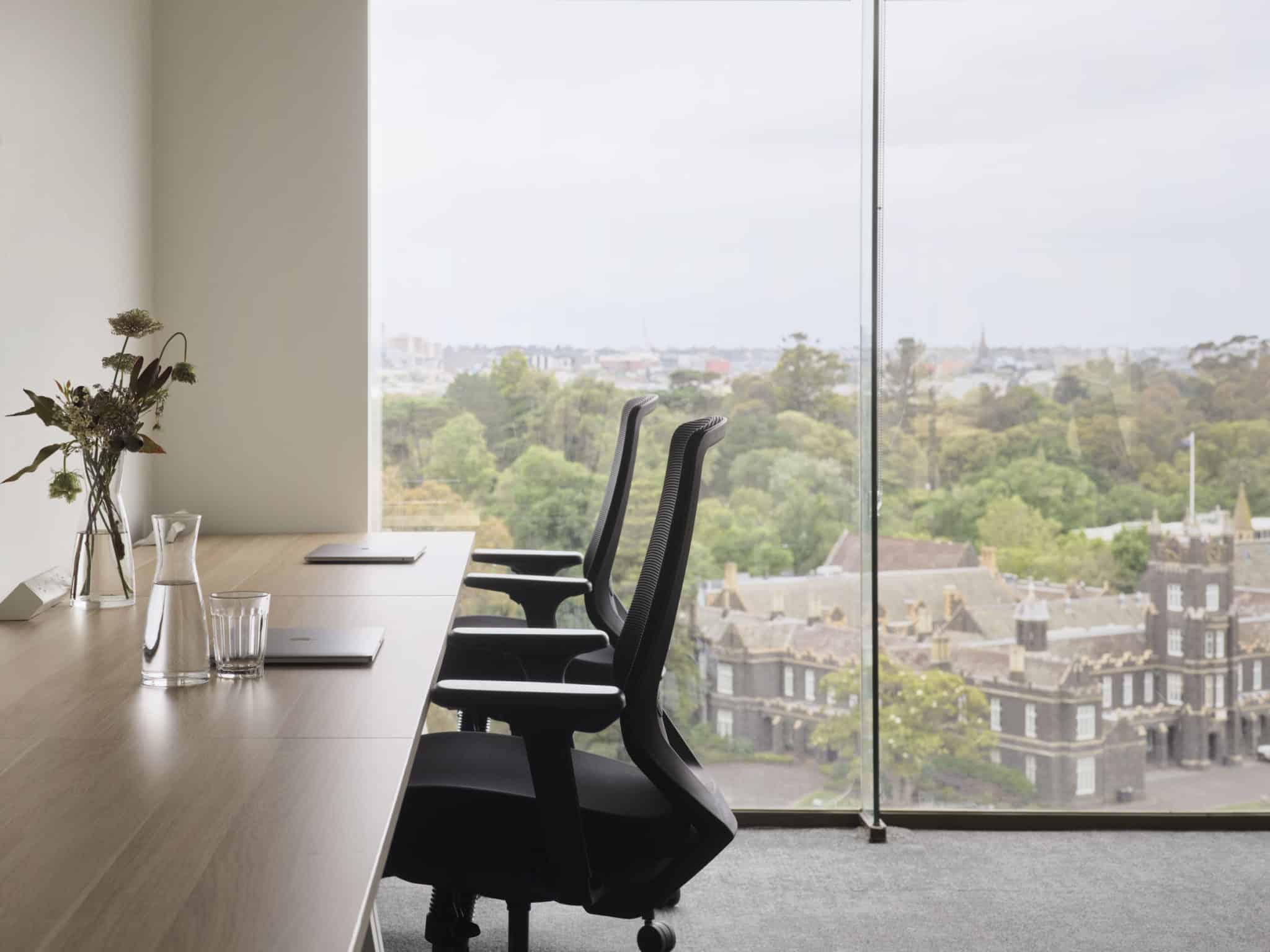 two office chairs with view in window at Hub St Kilda Road