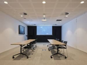 workshop space with tables and screens located in Hub Wynyard