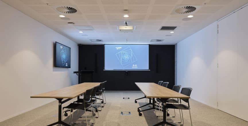 workshop space with tables and screens located in Hub Wynyard