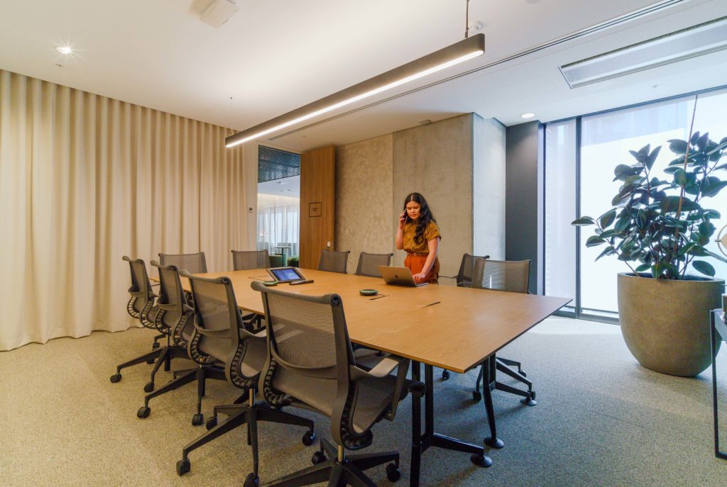 woman in meeting room on the phone