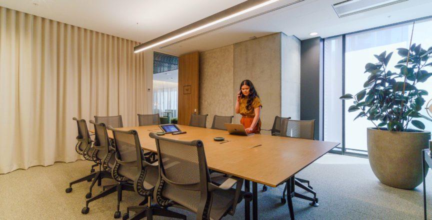 woman in meeting room on the phone