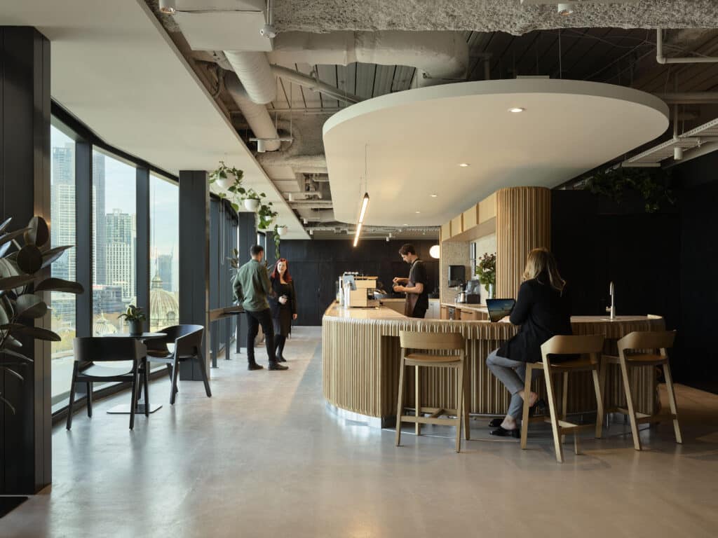 people standing in cafe area in an office