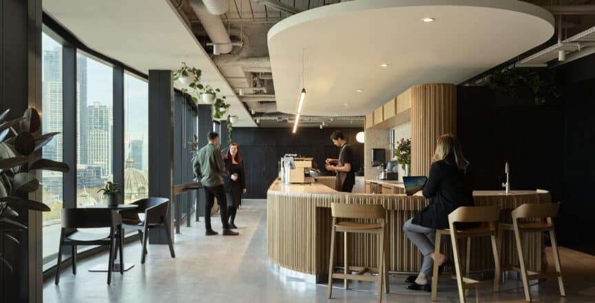 people standing in cafe area in an office