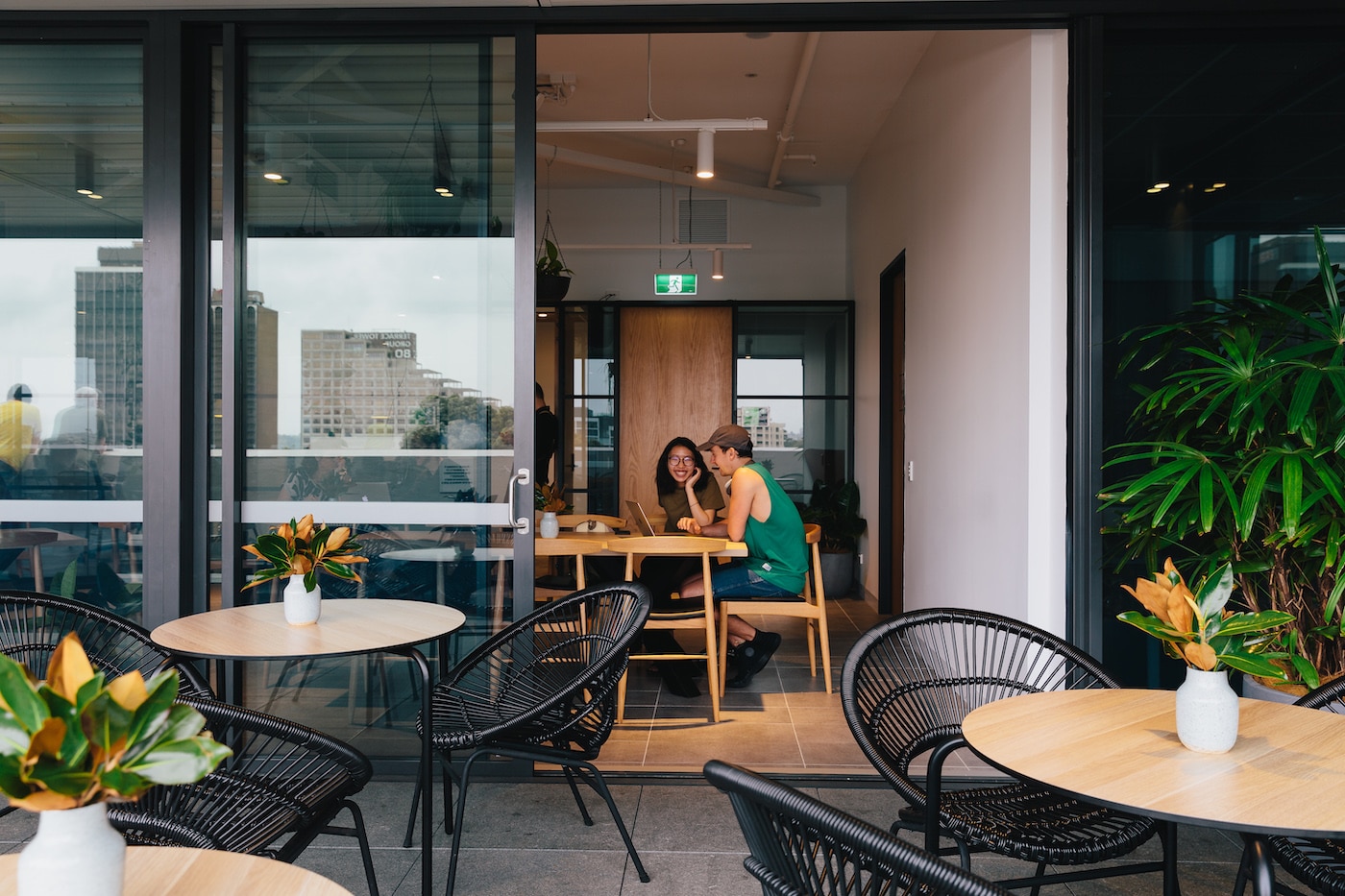 members sitting in terrace cafe