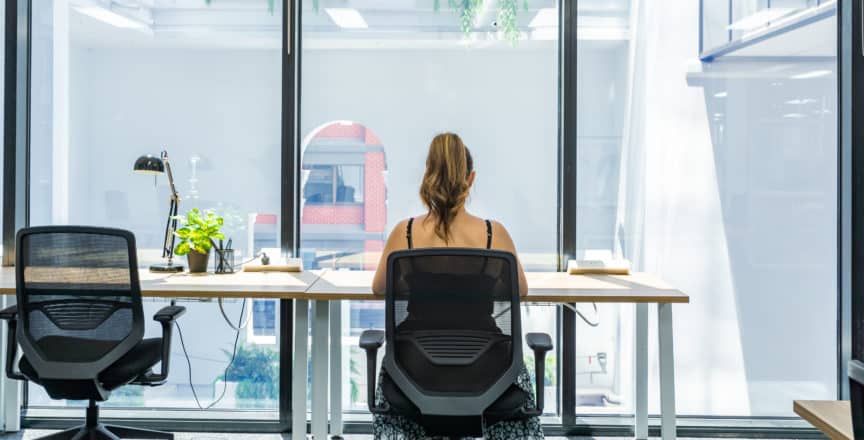 Woman working on her desk at Hub Adelaide