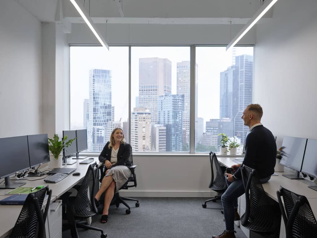 people in private office discussing business goals
