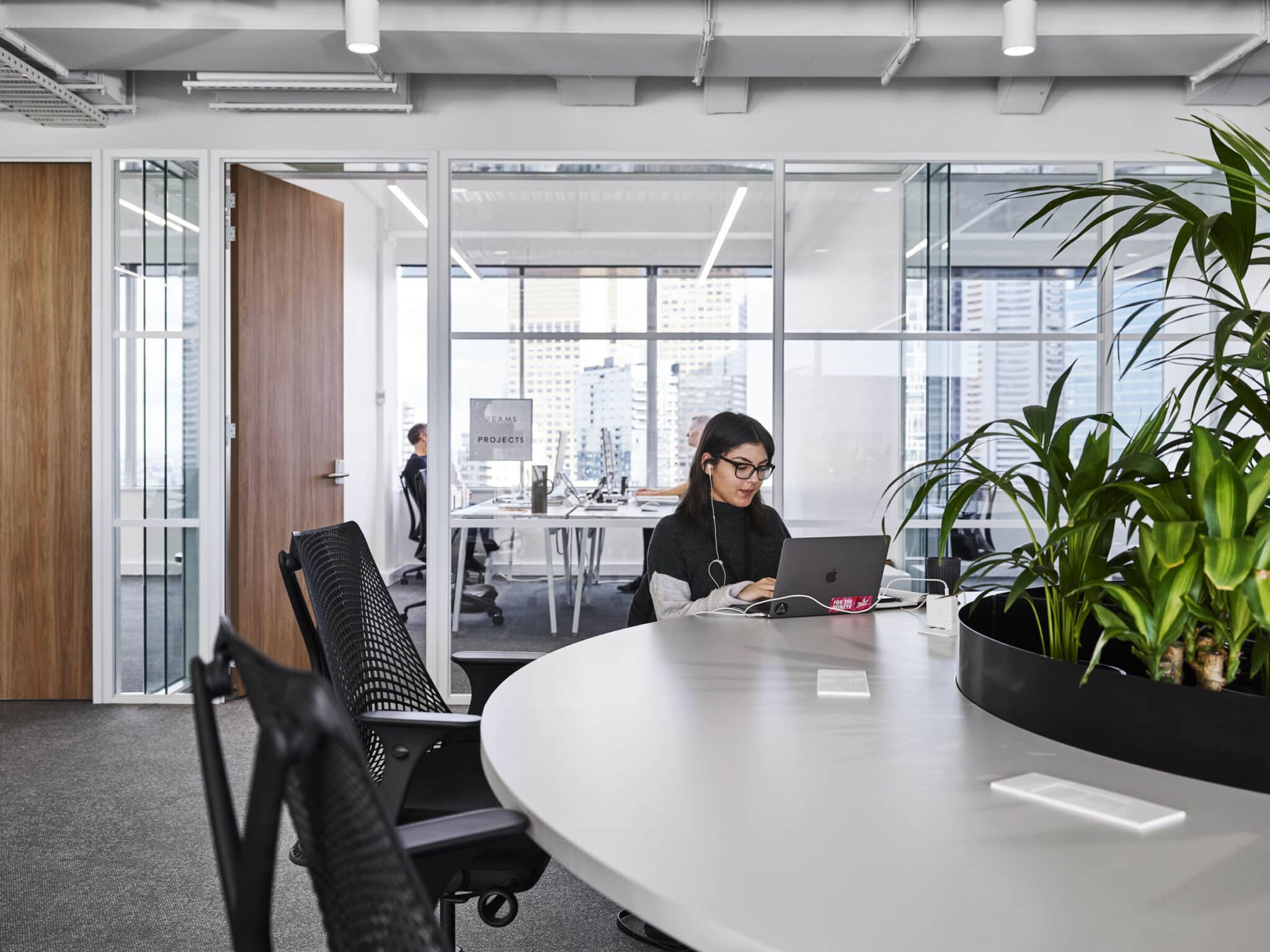 Gen Z employee working on their laptop